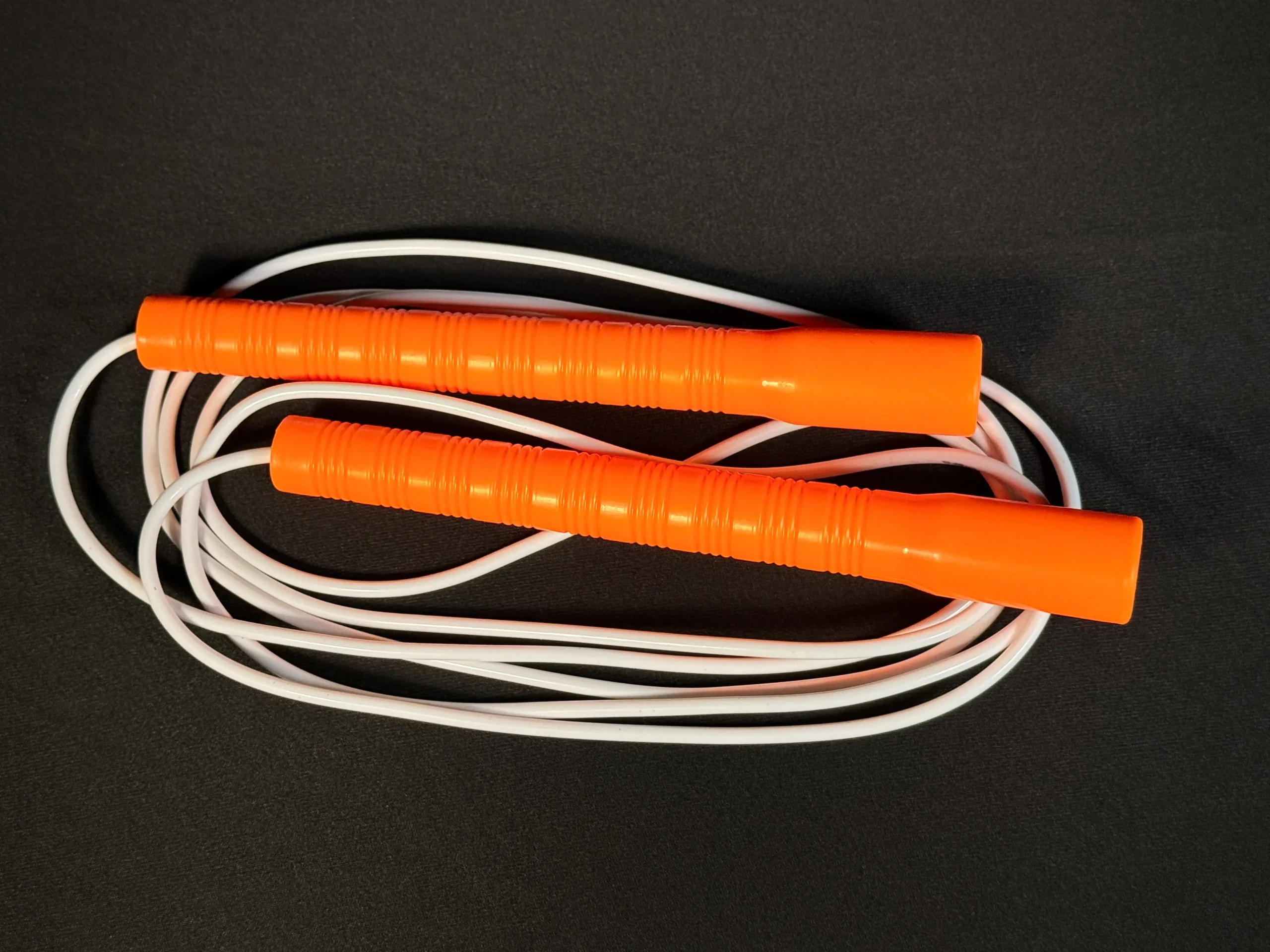 Basic long handle jump rope with lightweight plastic handles and PVC cord — ideal for beginner jumpers and casual skipping