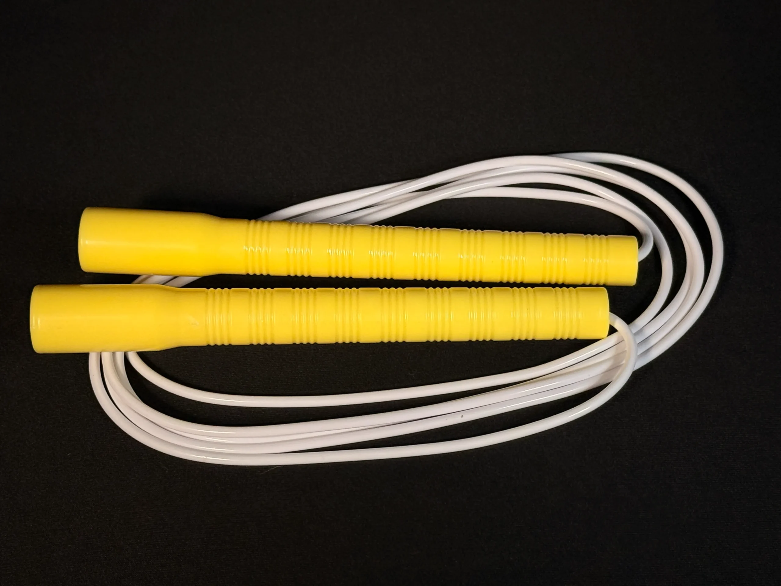 Basic long handle jump rope with lightweight plastic handles and PVC cord — ideal for beginner jumpers and casual skipping