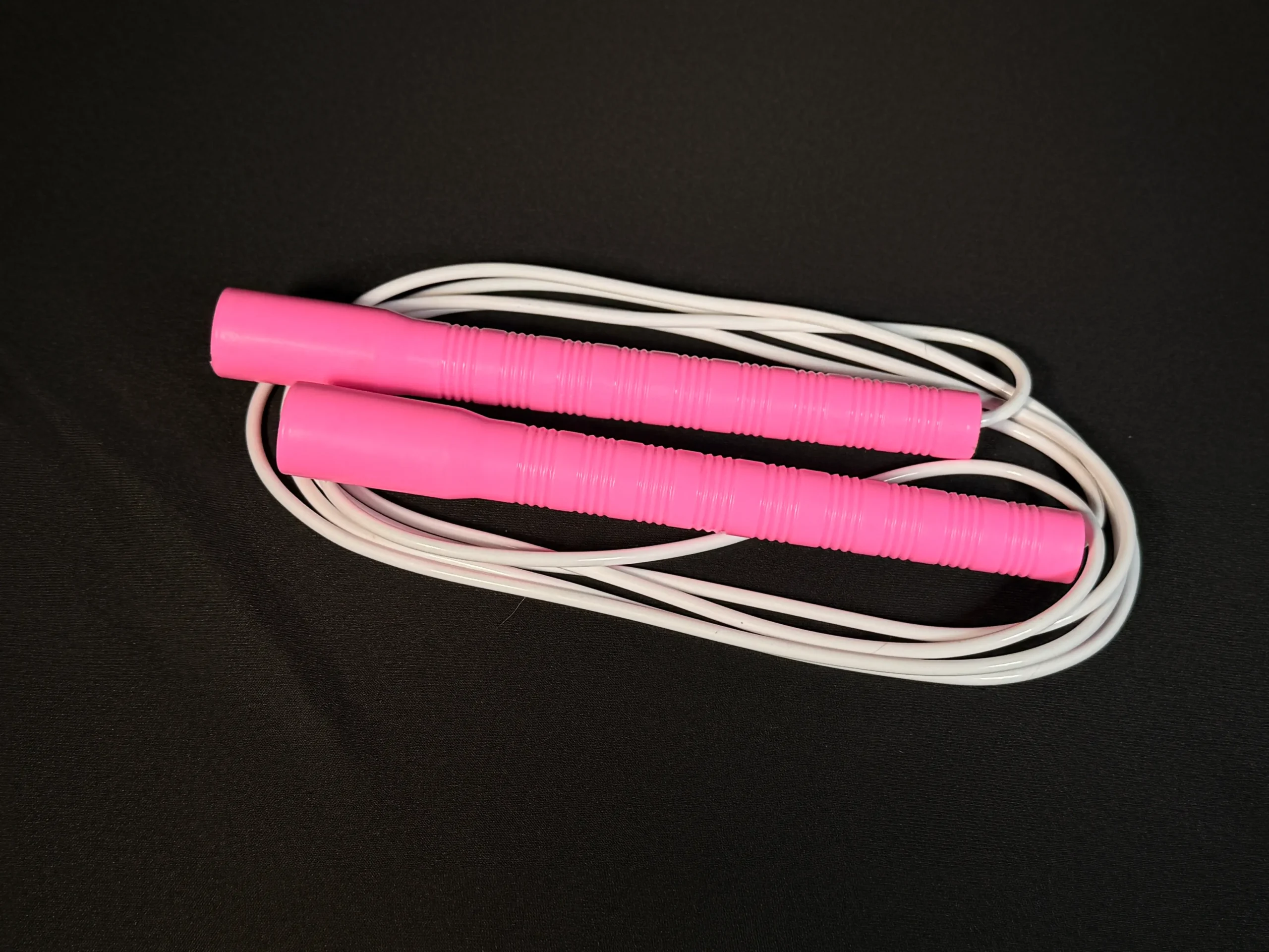 Basic long handle jump rope with lightweight plastic handles and PVC cord — ideal for beginner jumpers and casual skipping
