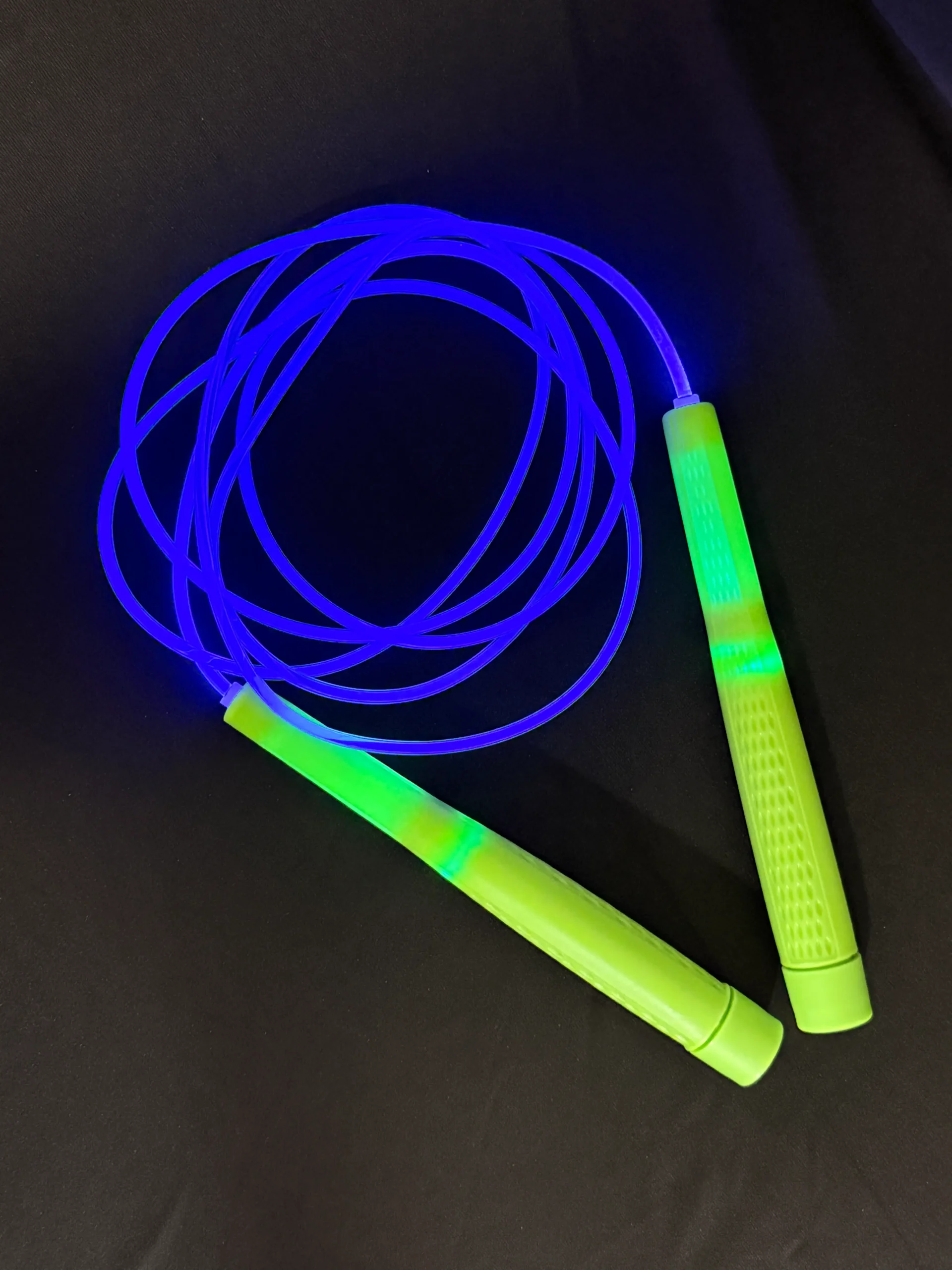 LED jump rope with glowing translucent cord and smooth control handles, designed for freestyle, content creation, and night-time rope training