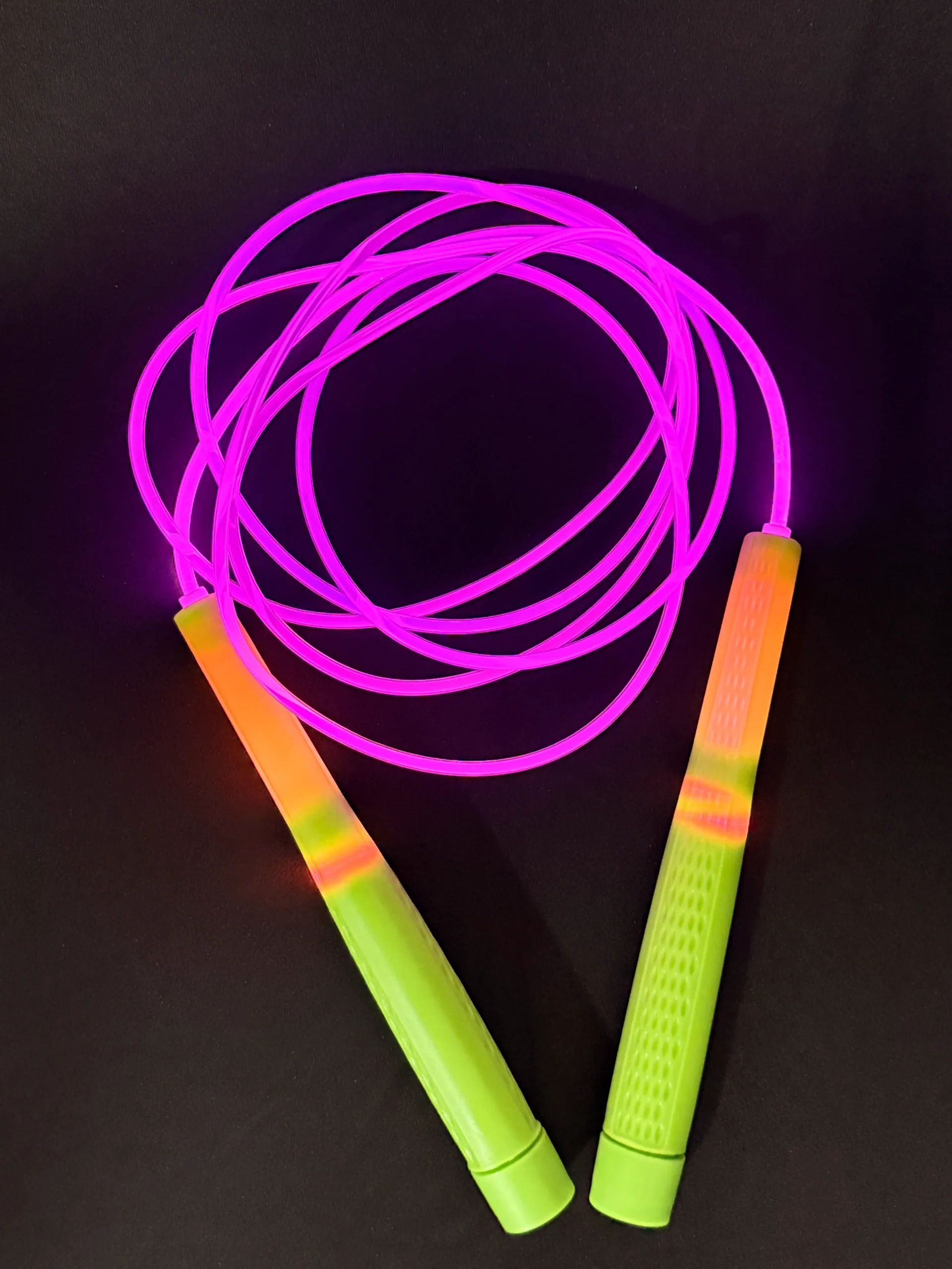 LED jump rope with glowing translucent cord and smooth control handles, designed for freestyle, content creation, and night-time rope training